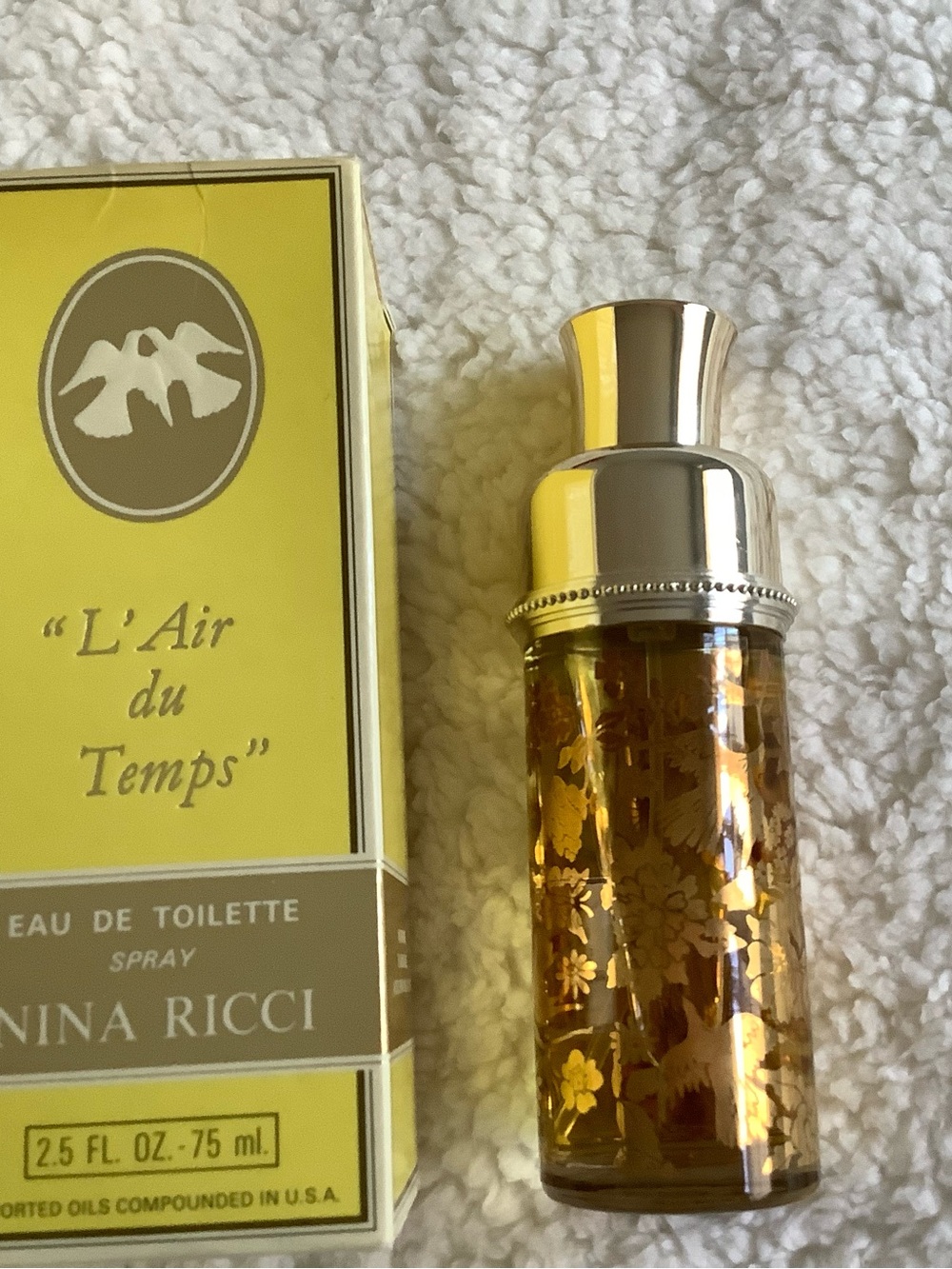 Nina Ricci L'Air du Temps Yellow and Gold Bottle